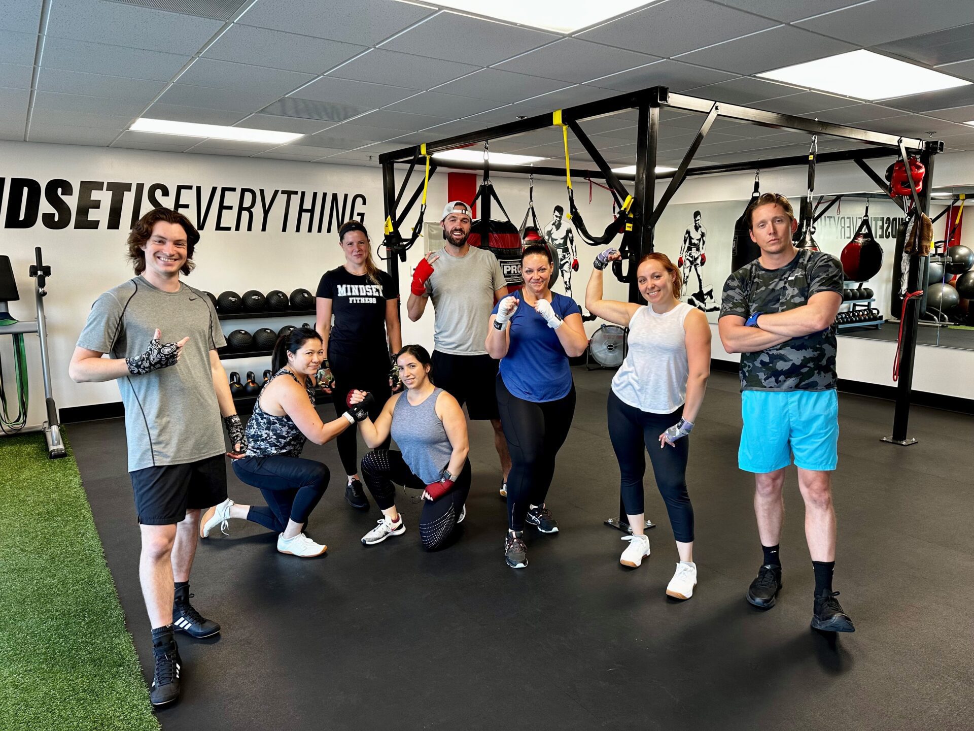 Smiled attractive girl mulatto with centimeter tape on the wais Group Fitness Class